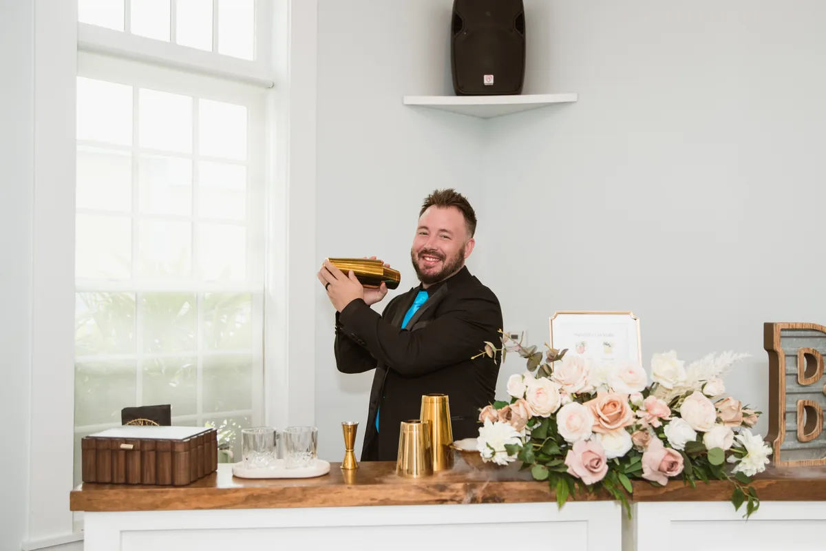 Founder Chris Goodnoe shaking a cocktail